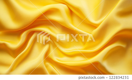 Yellow fabric with a wave pattern. The fabric is smooth and shiny. The color yellow is bright and cheerful Yellow fabric with a wave pattern. The fabric is smooth and shiny. The color yellow is bright and cheerful 122834231