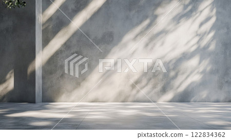 Large white wall with a shadow cast on it. The shadow is on the wall and the wall is made of concrete. The shadow is large and extends across the entire wall, creating a sense of depth and dimension 122834362