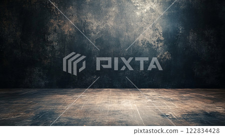 Dark room with a wall that is covered in graffiti. The room is empty and has a very industrial feel Dark room with a wall that is covered in graffiti. The room is empty and has a very industrial feel 122834428