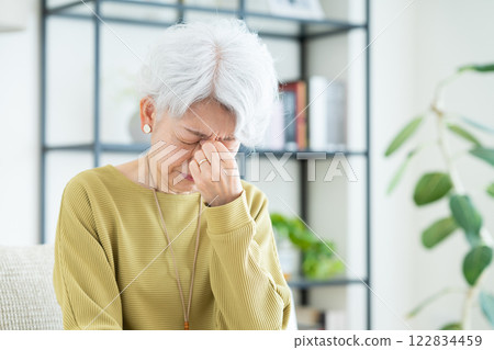 Senior woman with tired eyes 122834459