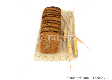 Bread and ears of wheat isolated on white. 122834709