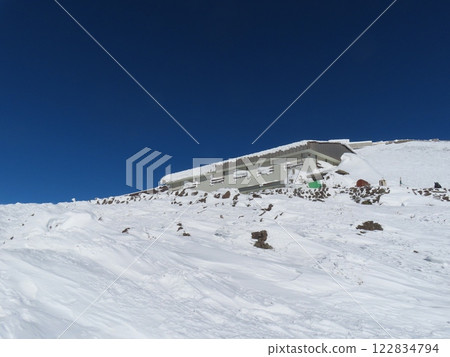 Mount Norikura in the harsh winter (mountain huts covered in snow and ice and closed for the winter) 122834794