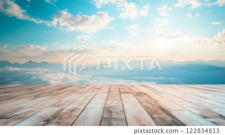 Beautiful blue sky with clouds and mountains in the background. The sky is clear and the sun is shining brightly 122834813