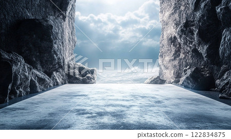 Rocky cliff with a large wave crashing into it. The scene is dark and moody, with the rocks and water creating a sense of danger and isolation 122834875