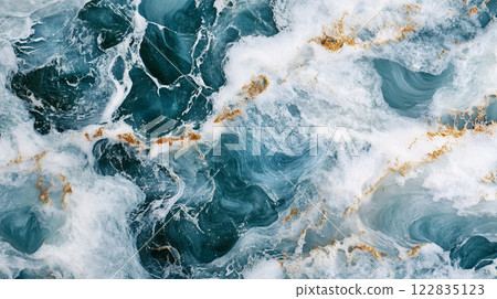 Beautiful blue ocean with a gold and white swirl pattern. The water appears to be foaming and has a sense of movement, giving the impression of a dynamic and lively scene. The combination of blue Beautiful blue ocean with a gold and white swirl pattern. The water appears to be foaming and has a sense of movement, giving the impression of a dynamic and lively scene. The combination of blue 122835123
