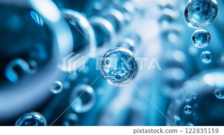 Close up of a blue liquid with many small bubbles. The bubbles are all different sizes and are scattered throughout the liquid. Concept of movement and fluidity 122835159