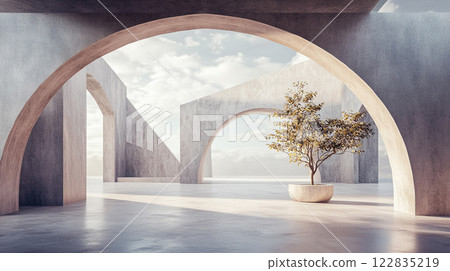 Tree is in a planter in the middle of a large, empty room with arched openings. The room is made of concrete and has a modern, minimalist design. The tree adds a touch of nature 122835219