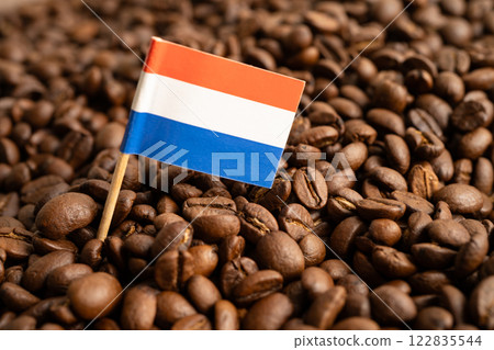 Netherlands flag on coffee bean, import export trade online commerce concept. Netherlands flag on coffee bean, import export trade online commerce concept. 122835544
