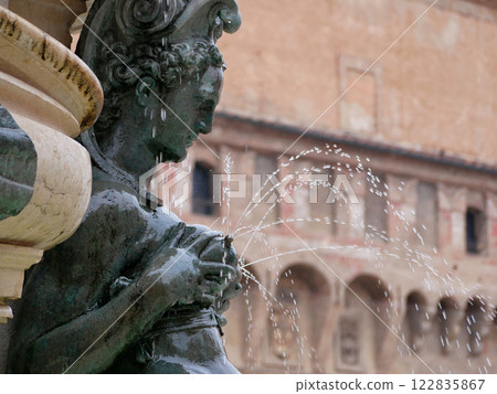 A sculpture of lactating Nereid as a part of The Fountain of Neptune in Bologna, Italy 122835867