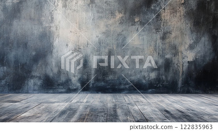 Large, empty room with a grey wall and wooden floor. The room is bare and empty, with no furniture or decorations. The grey wall and wooden floor give the room a cold, industrial feel 122835963