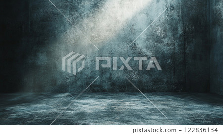 Dark room with a wall that is covered in graffiti. The room is empty and has a very cold and eerie atmosphere 122836134