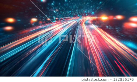 Blurry image of a highway with a bright blue line in the middle. Concept of motion and energy, as if the cars are racing down the road 122836176