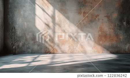 Room with a window and a plant in a vase. The room is empty and has a lot of sunlight coming in 122836242
