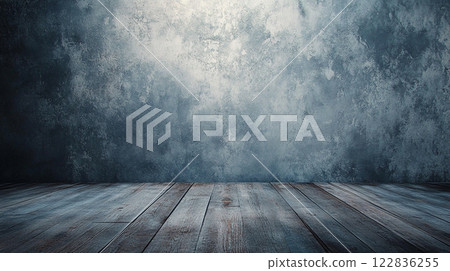 Wooden floor with a wall in the background. The wall is covered in a grey paint and has a rough texture. The floor is empty and has a natural, rustic feel to it Wooden floor with a wall in the background. The wall is covered in a grey paint and has a rough texture. The floor is empty and has a natural, rustic feel to it 122836255