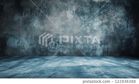 Large, empty room with a blue wall. The room is bare and empty, with no furniture or decorations. The blue wall gives the room a cold, sterile feel Large, empty room with a blue wall. The room is bare and empty, with no furniture or decorations. The blue wall gives the room a cold, sterile feel 122836388