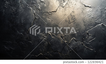 Black and grey wall with cracks and holes. The wall is rough and uneven, giving it a worn and aged appearance Black and grey wall with cracks and holes. The wall is rough and uneven, giving it a worn and aged appearance 122836421