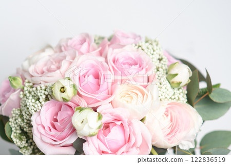 Beautiful bouquet of pink roses and ranunculus. stylish wedding attributes of bride. blooming flowers festive background, pastel and soft bouquet floral card Beautiful bouquet of pink roses and ranunculus. stylish wedding attributes of bride. blooming flowers festive background, pastel and soft bouquet floral card 122836519