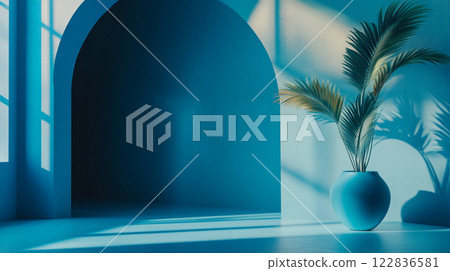 Blue room with a vase of palm leaves in it. The room is empty and the vase is the only object in it Blue room with a vase of palm leaves in it. The room is empty and the vase is the only object in it 122836581