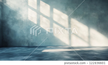 Large room with a window that is letting in sunlight. The room is empty and has a very clean and simple look Large room with a window that is letting in sunlight. The room is empty and has a very clean and simple look 122836601
