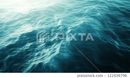 The image is of a large body of water with a blue color. The water appears to be calm and peaceful, with no visible waves or ripples. Scene is serene and tranquil The image is of a large body of water with a blue color. The water appears to be calm and peaceful, with no visible waves or ripples. Scene is serene and tranquil 122836796