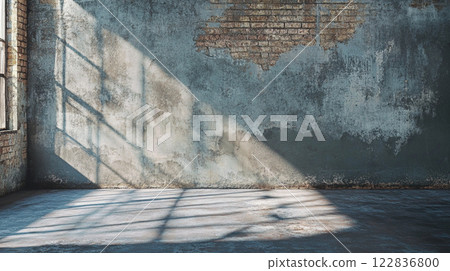 Large room with a brick wall and a window. The room is empty and has a lot of natural light coming in through the window Large room with a brick wall and a window. The room is empty and has a lot of natural light coming in through the window 122836800