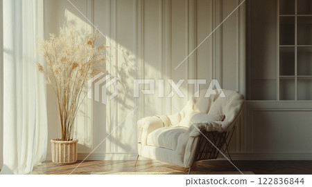 White chair is sitting in front of a window with a potted plant in a basket. The room is bright and airy, with sunlight streaming in through the window White chair is sitting in front of a window with a potted plant in a basket. The room is bright and airy, with sunlight streaming in through the window 122836844