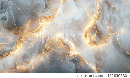 Gold and white marble wall with a gold and white design. The wall is covered in gold and white swirls and has a warm, inviting feel 122836880