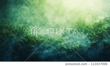 Green background with a lot of green grass and a lot of smoke. The smoke is coming from a fire 122837006