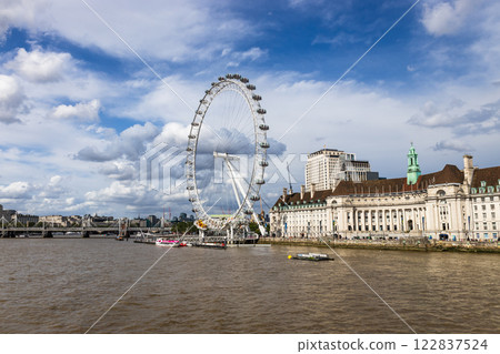 The London Eye and River Thames on a Partly Cloudy Day in London, England The London Eye and River Thames on a Partly Cloudy Day in London, England 122837524