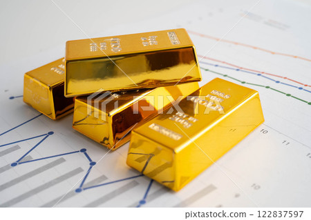 Gold bars on graph paper, finance trading investment business currency. 122837597