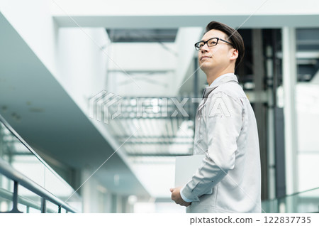 Male engineer working in an office [Filming cooperation: SKY Perfect Tokyo Media Center] 122837735