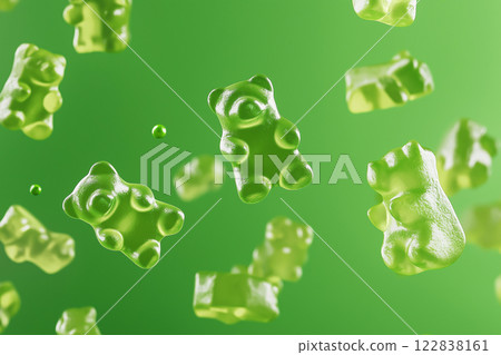 Green gummy bears floating in air on a vibrant green background. Gummy bear candies suspended in mid-air over monochromatic green backdrop. Sweets and happy childhood concept. 122838161