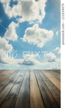 Beautiful wooden platform overlooking a serene cloudy sky during sunrise 122839479