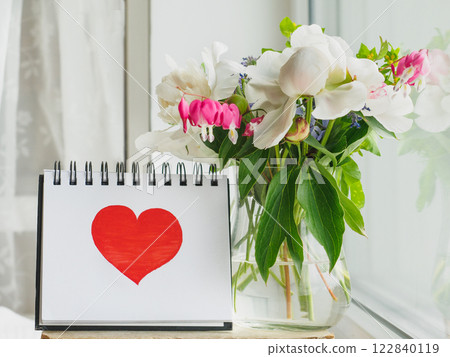 Bouquet of bright flowers standing in a vase 122840119