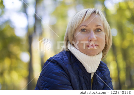 Portrait of a middle aged woman in a street 122840158