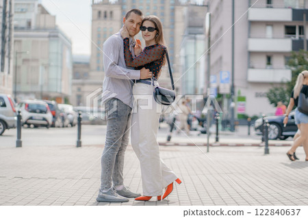 Two tourists having fun on romantic summer vacation in Poland - Holidays and traveling lifestyle concept. Young couple walking street on vacation. Happy couple of travelers enjoying. Two tourists having fun on romantic summer vacation in Poland - Holidays and traveling lifestyle concept. Young couple walking street on vacation. Happy couple of travelers enjoying. 122840637