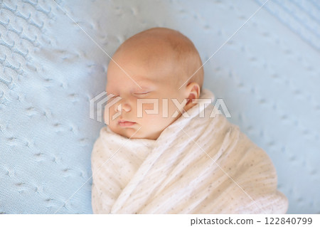 Little baby on white bed 122840799