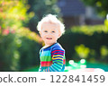 Baby boy in summer garden 122841459