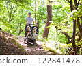 Father with children in all terrain stroller 122841478