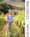 Pregnant mother and kids in autumn park 122841486