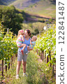 Pregnant mother and kids in autumn park 122841487