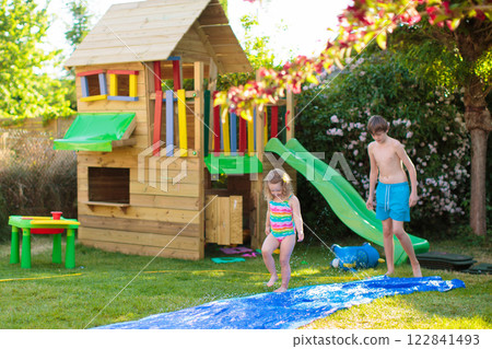 Kids playing in swimming pool Kids playing in swimming pool 122841493