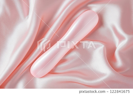 Vibrator on pink background, top view 122841675