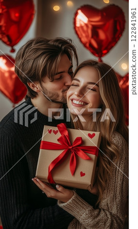 Romantic Valentine s Day Man Surprises Girlfriend with Gift, Kisses, and Heart Balloons 122841961