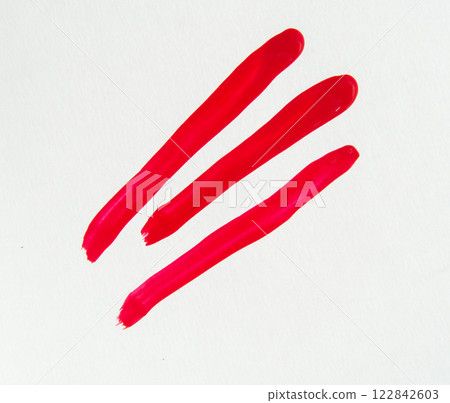 Smears of red nail polish on a white background, beauty concept 122842603