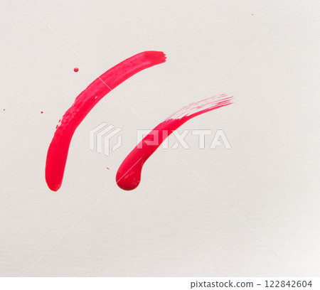 Smears of red nail polish on a white background, beauty concept 122842604