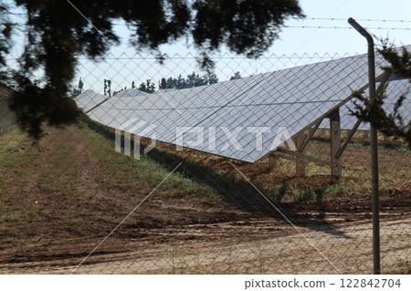 Alternative types of electricity generation, solar panels, wind power generation. Electricity production system from natural sources, renewable energy. 122842704