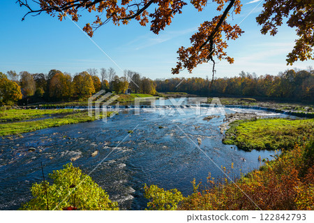 Picturesque autumn landscape of the widest European waterfall on the Venta River in Latvia Picturesque autumn landscape of the widest European waterfall on the Venta River in Latvia 122842793