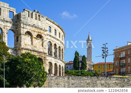 Ancient Roman amphitheater arena and Saint Anthony church tower in Pula, Istria peninsula, Croatia 122842856
