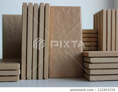 Side view of stacks of same ceramic tiles isolated on white stock photo  122843259